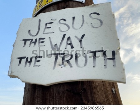 handdrawn jesus the way the truth sign stapled onto wooden pole