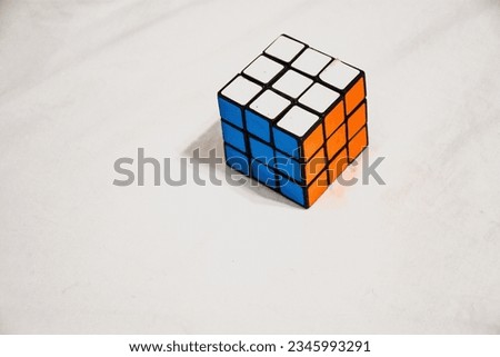 Solved Rubik Cube, minimalistic background Royalty-Free Stock Photo #2345993291