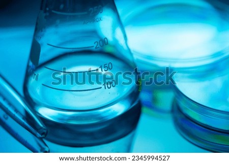 Laboratory glass and liquids. Laboratory concept. Royalty-Free Stock Photo #2345994527