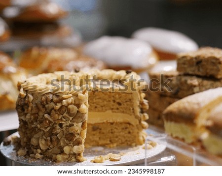 Coffee and Walnut Cake in Cafe Tea Shop Display, Gateau Slice, Delicious Sweet Treats, Tasty Food