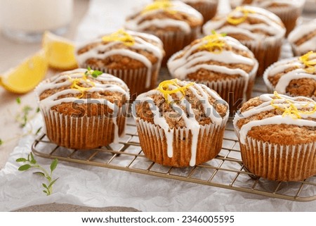 Lemon zucchini muffins with thyme and drizzled with cream cheese glaze Royalty-Free Stock Photo #2346005595