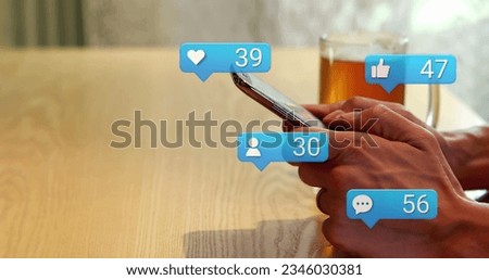 Image of social media icons falling over person using smartphone. Social media and communication concept digitally generated image.