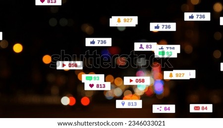 Image of social media icons and numbers over out of focus city lights. global social media, networking, connections and digital interface concept digitally generated image.