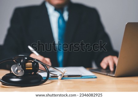 A personal injury lawyer holds the authority in law to guide clients toward a just decision, wielding the gavel of justice. Royalty-Free Stock Photo #2346082925