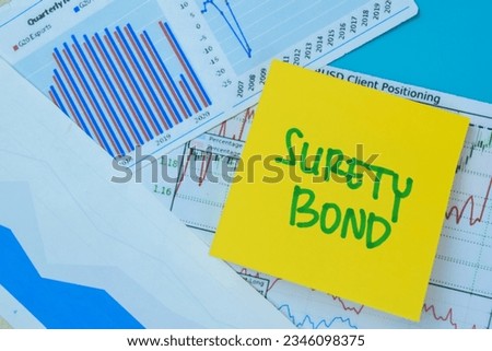Concept of Surety Bond write on book isolated on Wooden Table. Royalty-Free Stock Photo #2346098375