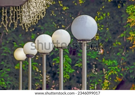 Decorative lamps at the entrance on a summer day