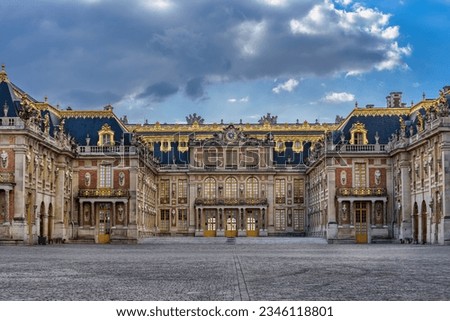 Facade and main entrance of the baroque style Versailles Palace in a cloudy spring evening Royalty-Free Stock Photo #2346118801