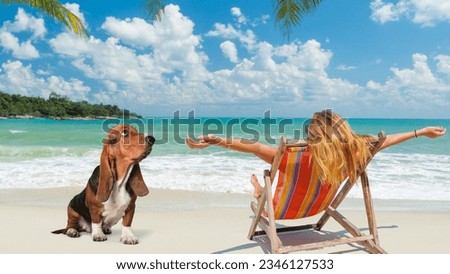 A young woman and her dog are enjoying a day at the beach. The woman is sitting on a chair, while the dog is sitting beside him. This image would be perfect for a pet photography portfolio.