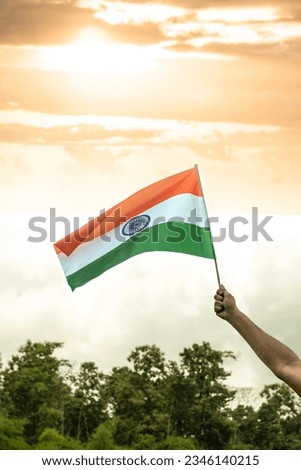 Holding Indian flag with copy space, Happy Independence day India and Republic day concept photo Royalty-Free Stock Photo #2346140215