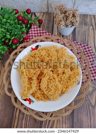 Kremesan is crispy batter made from chicken stock,rice flour,eggs and spices. Usually served with chicken as ayam kremes