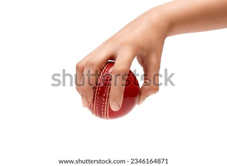 A Female Hand Holding A Red Test Match Leather Stitch Cricket Ball Closeup Photo White Background