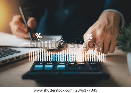 Investment in percentage. income tax paid, dividend, interest rate and corporations. Businessman calculating with calculator, laptop (notebook) of return on financial research, report, investment. Royalty-Free Stock Photo #2346177343