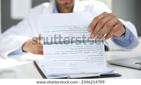 Medical worker looking at a patient's medical history close-up