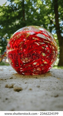 ball with red abstraction on the ground