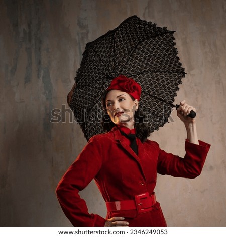 Mary Poppins. A stylish lady in a red old-fashioned suit with a hat and a lace umbrella Royalty-Free Stock Photo #2346249053