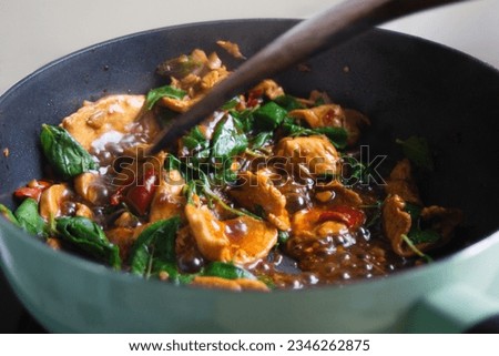 Thai food, Chicken Holy Basil Stir-fry (Pad Kra Pao Gai), being cooked. Royalty-Free Stock Photo #2346262875