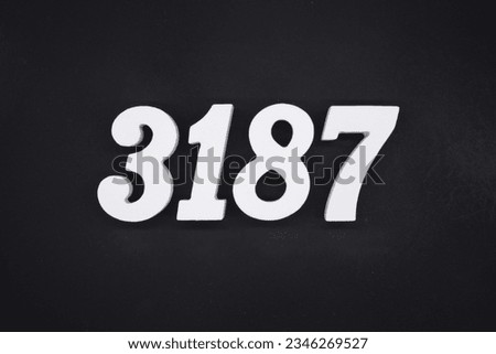 Black for the background. The number 3187 is made of white painted wood.