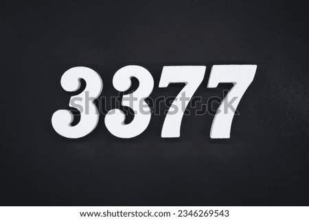 Black for the background. The number 3377 is made of white painted wood.