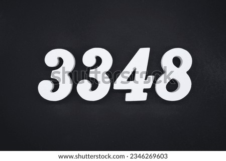 Black for the background. The number 3348 is made of white painted wood.