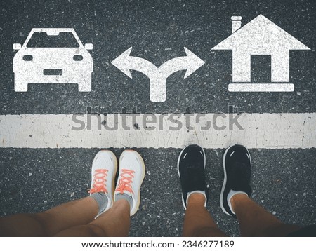 Deciding on a house or a car A couple deciding between a house or a car in the future.