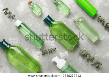 Herbal cosmetic products on color background, top view Royalty-Free Stock Photo #2346297913