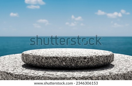 Empty round stone platform on seascape background