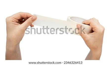 Hands hold masking tape isolated on white background. Adhesive tape is wrapped in your hands Royalty-Free Stock Photo #2346326413
