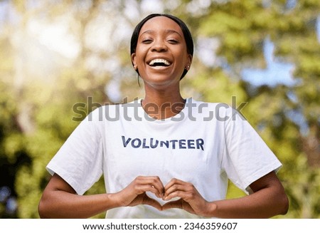 Heart, hands and African volunteer woman with sign for care, support and charity outdoor in nature, forest or environment. Show, love and happy person helping in community or service with empathy Royalty-Free Stock Photo #2346359607