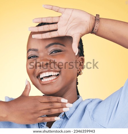 Hands, face frame and portrait of black woman in studio for confidence, creativity and beauty. Photography, perspective and happy African person on yellow background in cosmetics, makeup and glamour