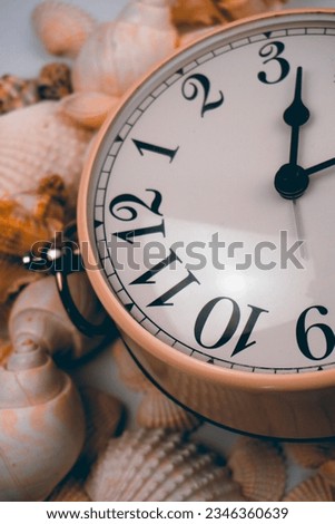 Alarm clock with shells , Summertime Concept 
