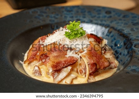 Creamy carbonara enriched with bacon and cheese Royalty-Free Stock Photo #2346394795