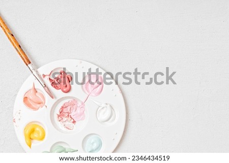 Artist painting palette with brushes. Craft hobby background. Recomforting, destressing hobby, art therapy Royalty-Free Stock Photo #2346434519