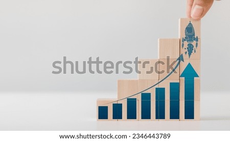 Growth hacking concept with a chart and a rocket flying up. A modern approach to marketing, combining creativity and technical savvy to rapidly increase business growth, and automation to drive growth Royalty-Free Stock Photo #2346443789