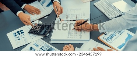 Auditor team collaborate in office, analyzing financial data and accounting record. Expertise in finance and taxation with accurate report and planning for company revenue, expense and budget. Insight Royalty-Free Stock Photo #2346457199