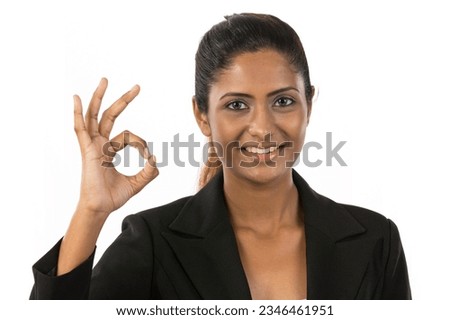 Happy Asian woman doing OK symbol with her hand. Isolated on white background.