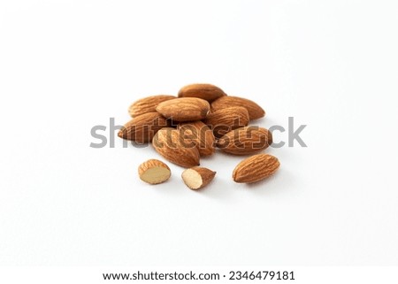 Tasty almonds on a white background.