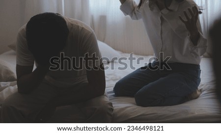 Upset woman having a fight with a man at home. Hispanic wife slapping the face of her husband during an argument because of their relationship problems Royalty-Free Stock Photo #2346498121
