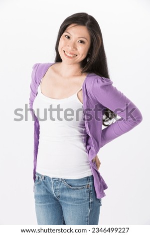 Happy Asian woman in casual clothes. Isolated on white background.