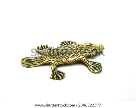 platypus golden color animal statue on white background
