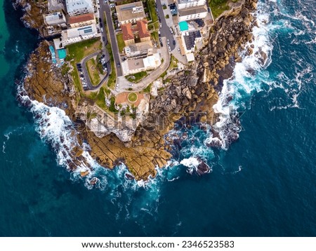 Drone aerial point of view cityscape skyline skyscrapers and village community people house by ocean coastline beach at NSW, Australia. Landmark famous place, beauty nature and tourism concept.