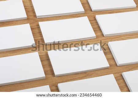 identity design, corporate templates, company style, blank business cards on a wooden background
