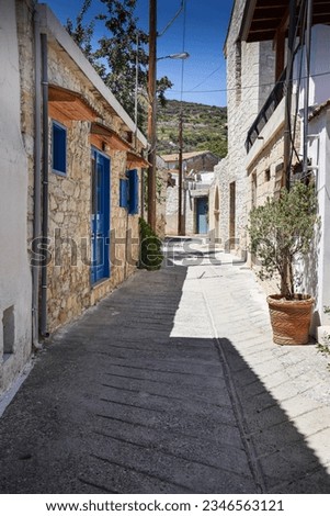 Street view in the old town with old colored houses and cobbled road on a summer sunny day. Beautiful architecture on the island of Cyprus.