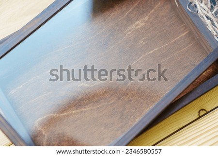 Wooden box with glass lid to give beautiful photos. The work of a professional photographer.