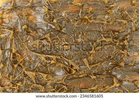 Close-Up of Brown-colored textured MPLR lubricating molybdenum disulfide grease for machinery lubrication. Top view Royalty-Free Stock Photo #2346581605