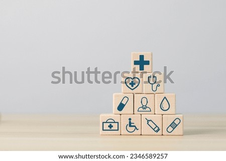 Wooden block with concept of health care, medical icons
