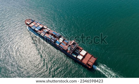 cargo container ship sailing full speed in sea to import export goods and distributing products to dealer and consumers worldwide, by container ship Transport business delivery service, aerial view Royalty-Free Stock Photo #2346598423