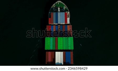 top view head shot of cargo container ship sailing in dark sea background to import export goods and distributing products to dealer and consumers worldwide, by container ship Transport business