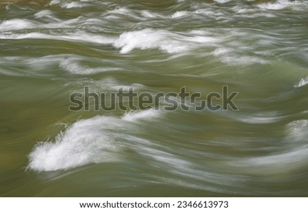 Full-flowing mountain river in the Carpathian Mountains
