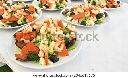 a photography of a table with plates of food on it, several plates of food are arranged on a table with a white table cloth.