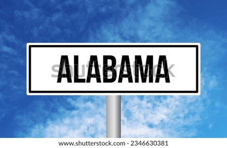 Alabama road sign on blue sky background